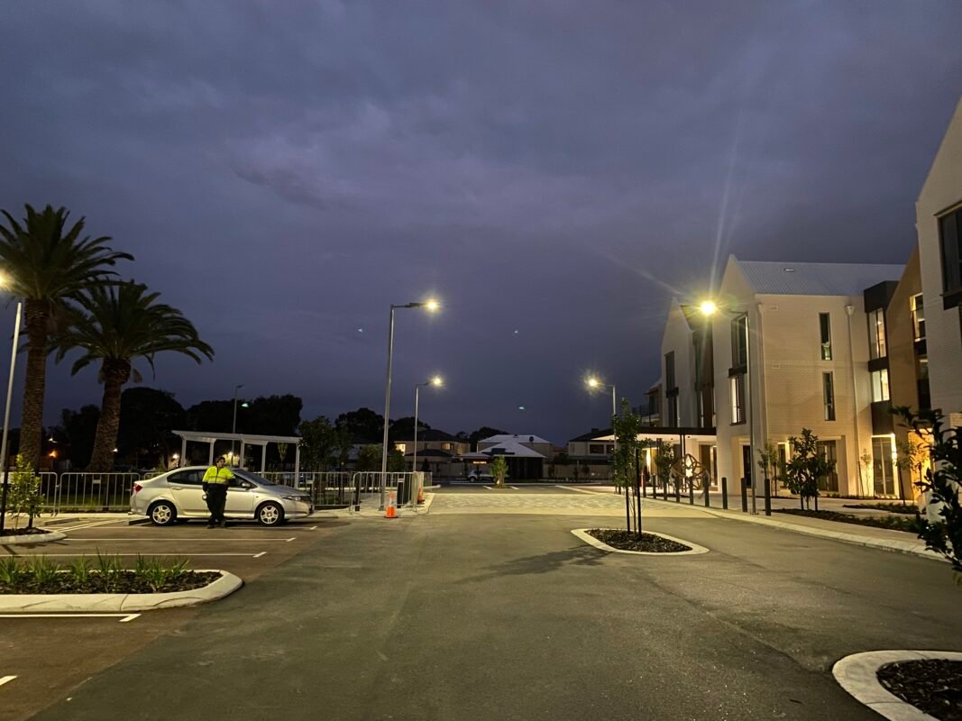 A modern Australian community illuminated by LEYOND's all-in-one solar street lights at dusk.