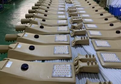 Completed assembly of custom Royal Gold solar street lights with detachable spigots ready for packaging