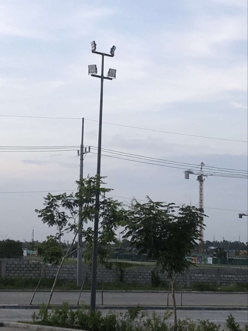 Close up of black 150W modular LED flood lights on high mast in Manila