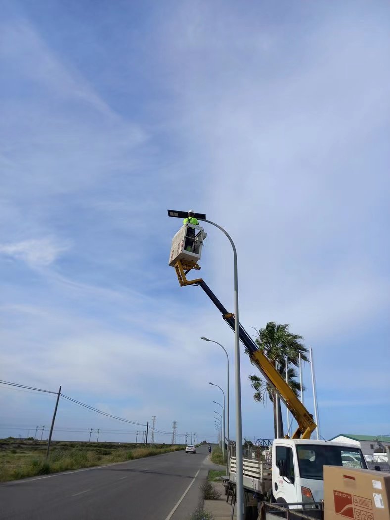 Professional installation of Sunplus solar light using lift truck in Portugal