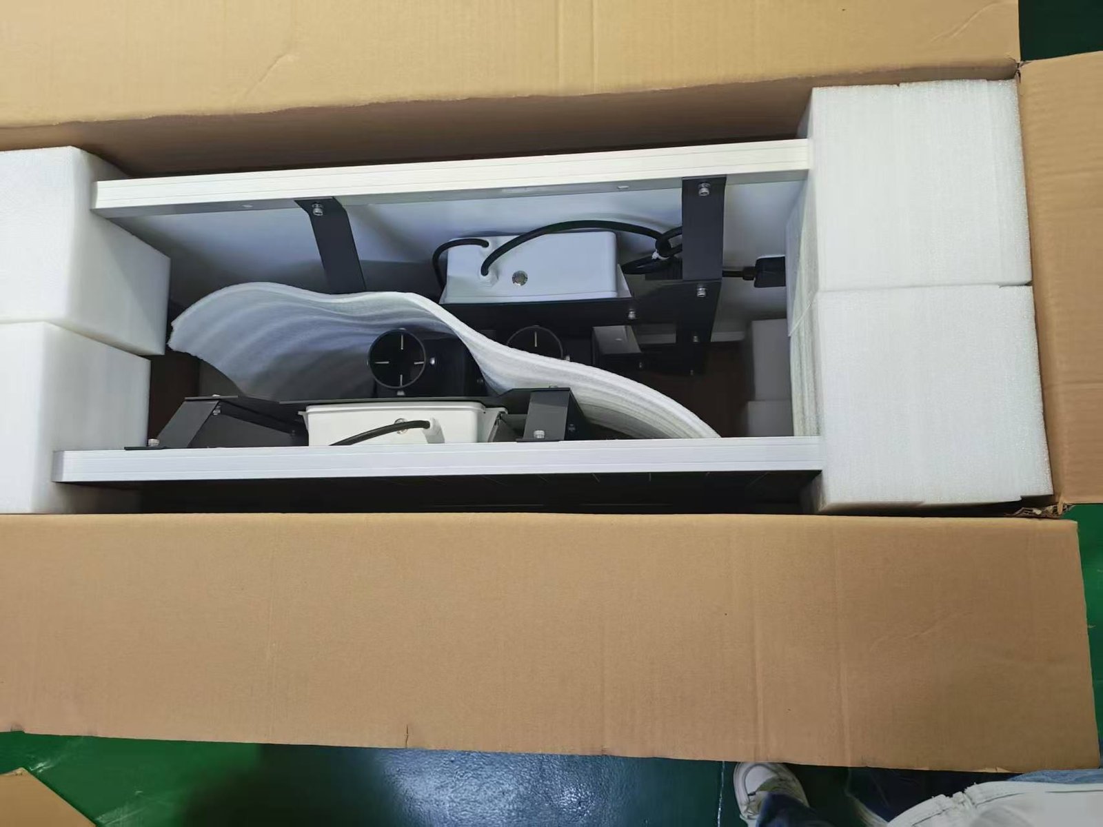 Secure packaging of split solar street light components