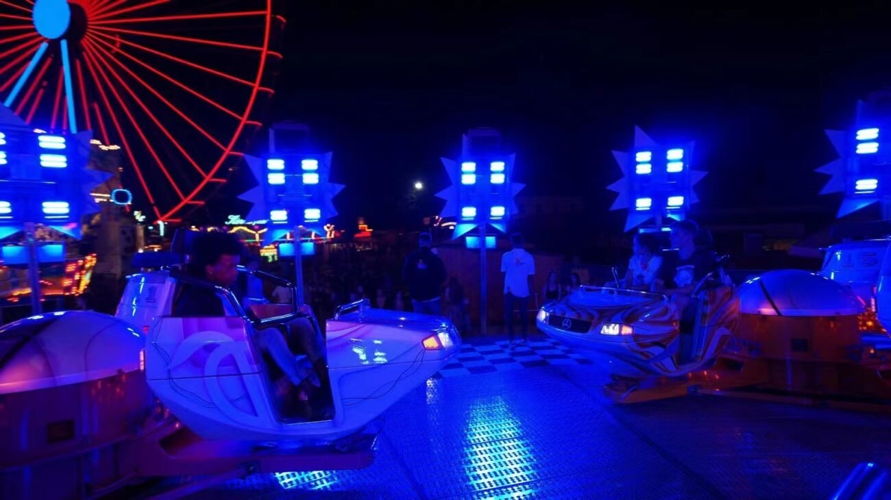 Stunning RGB LED lighting effects on amusement park facilities, ideal for Ferris wheels and childhood playgrounds.